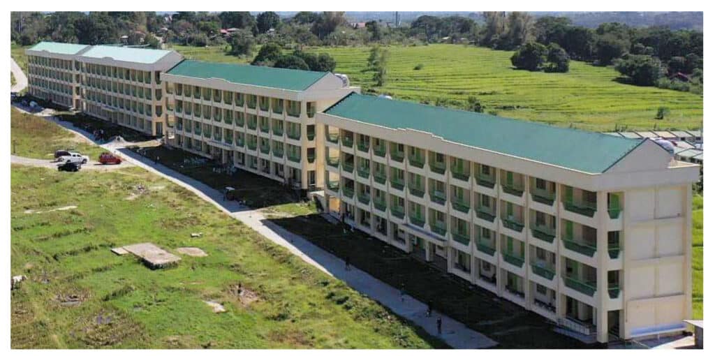 Sample arrangement of school buildings arranged along the perimeter line of the school property to maximize the open area at the center of the property for school activities.